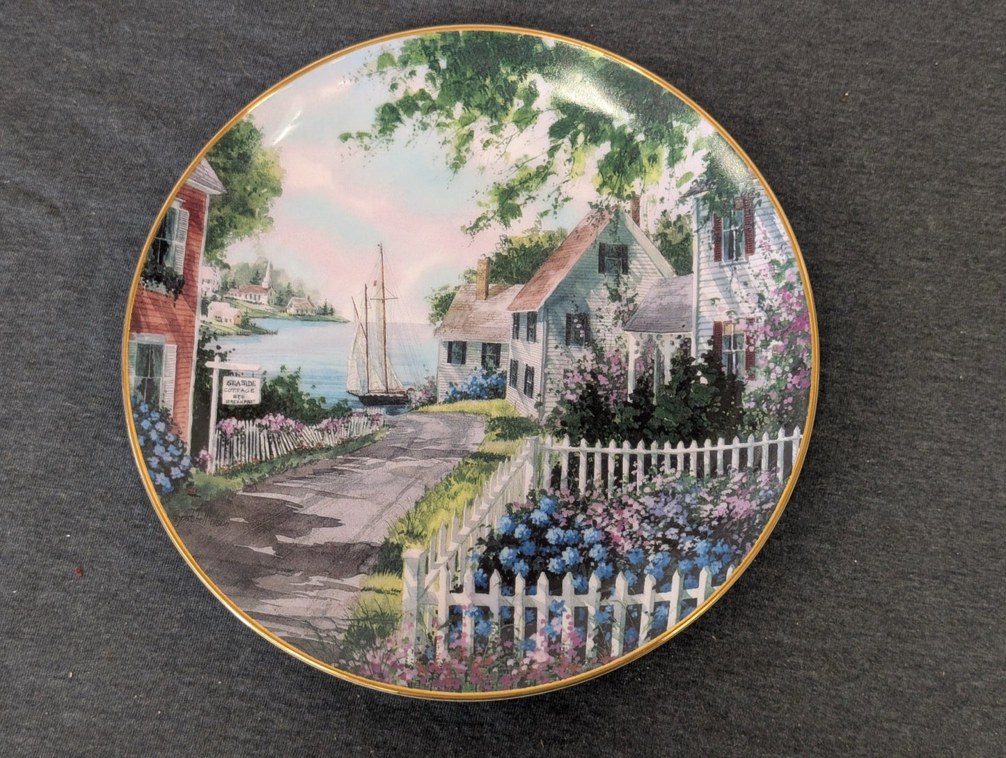 Danbury Mint Harborside Collector Plate showing a picturesque coastal cottage scene