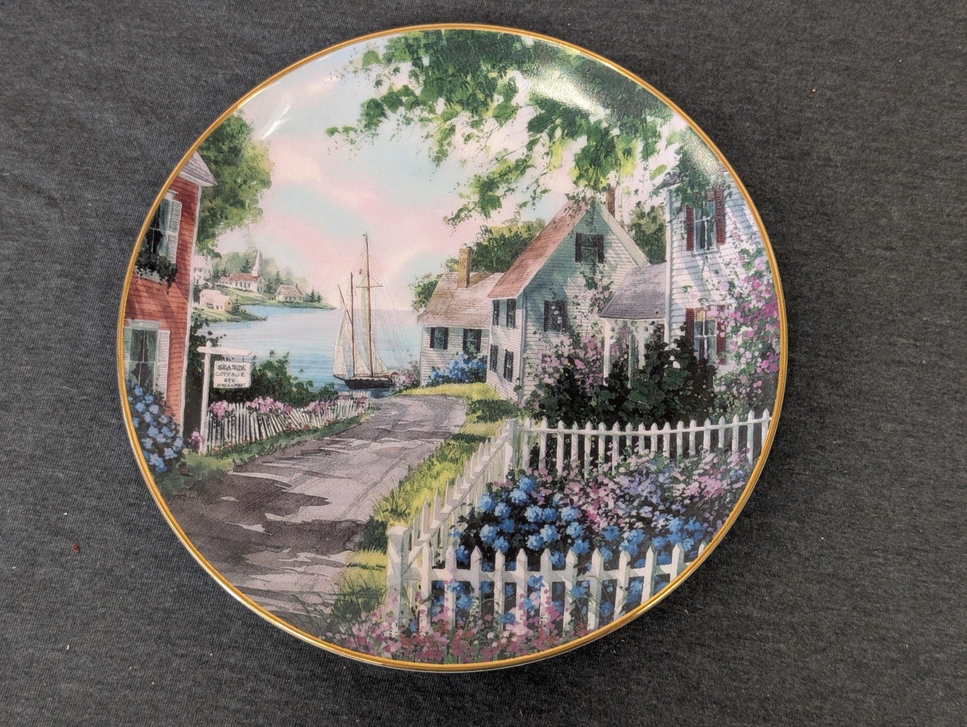 Danbury Mint Harborside Collector Plate showing a picturesque coastal cottage scene