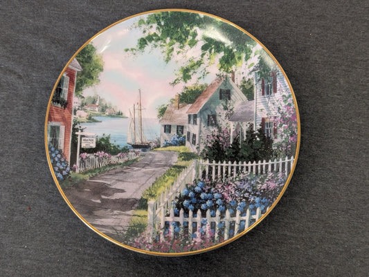 Danbury Mint Harborside Collector Plate showing a picturesque coastal cottage scene