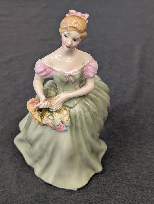 Royal Doulton Clarissa figurine in green dress holding flowers