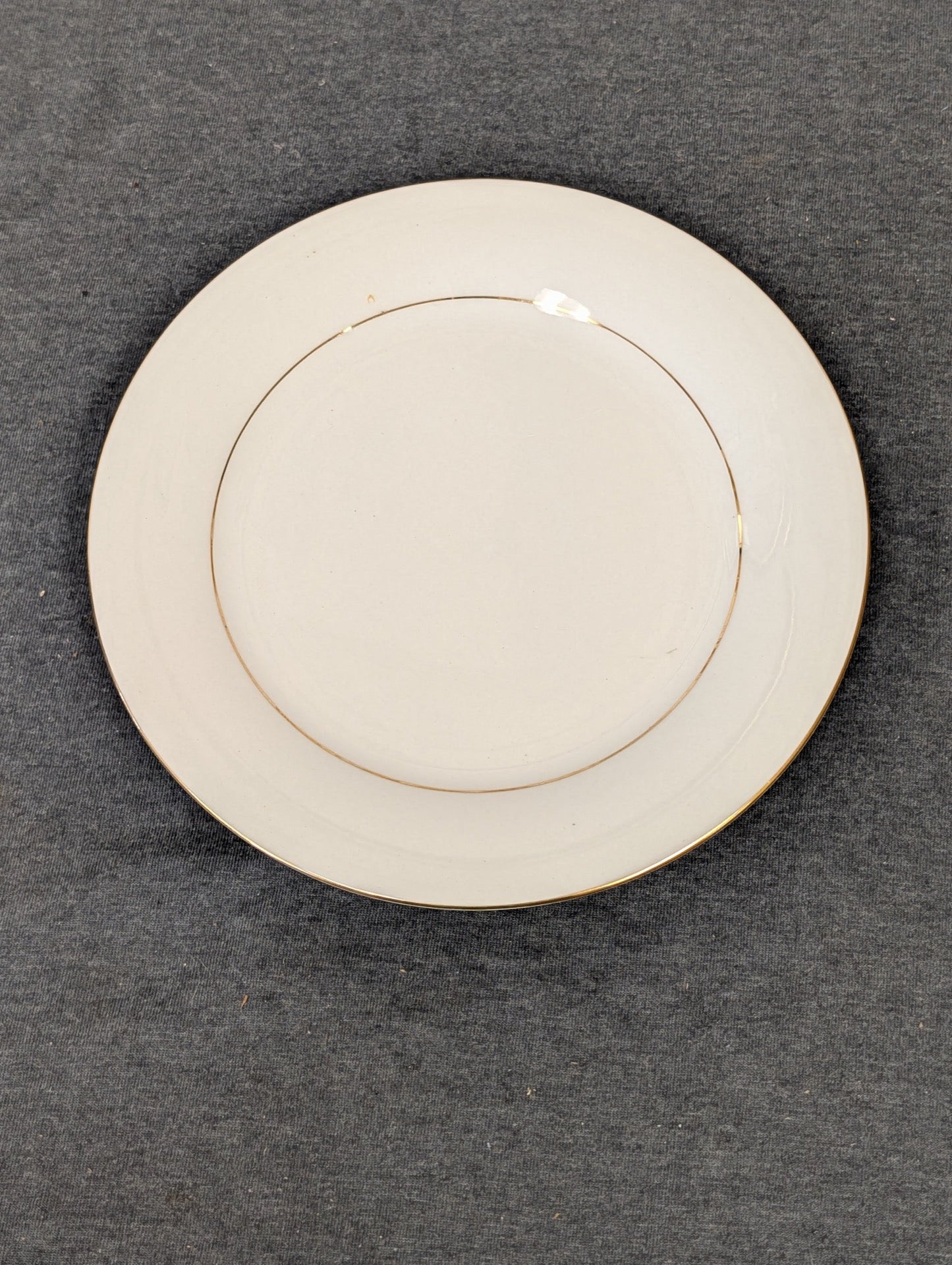 Top view of white Sakura Classic Gold salad plate