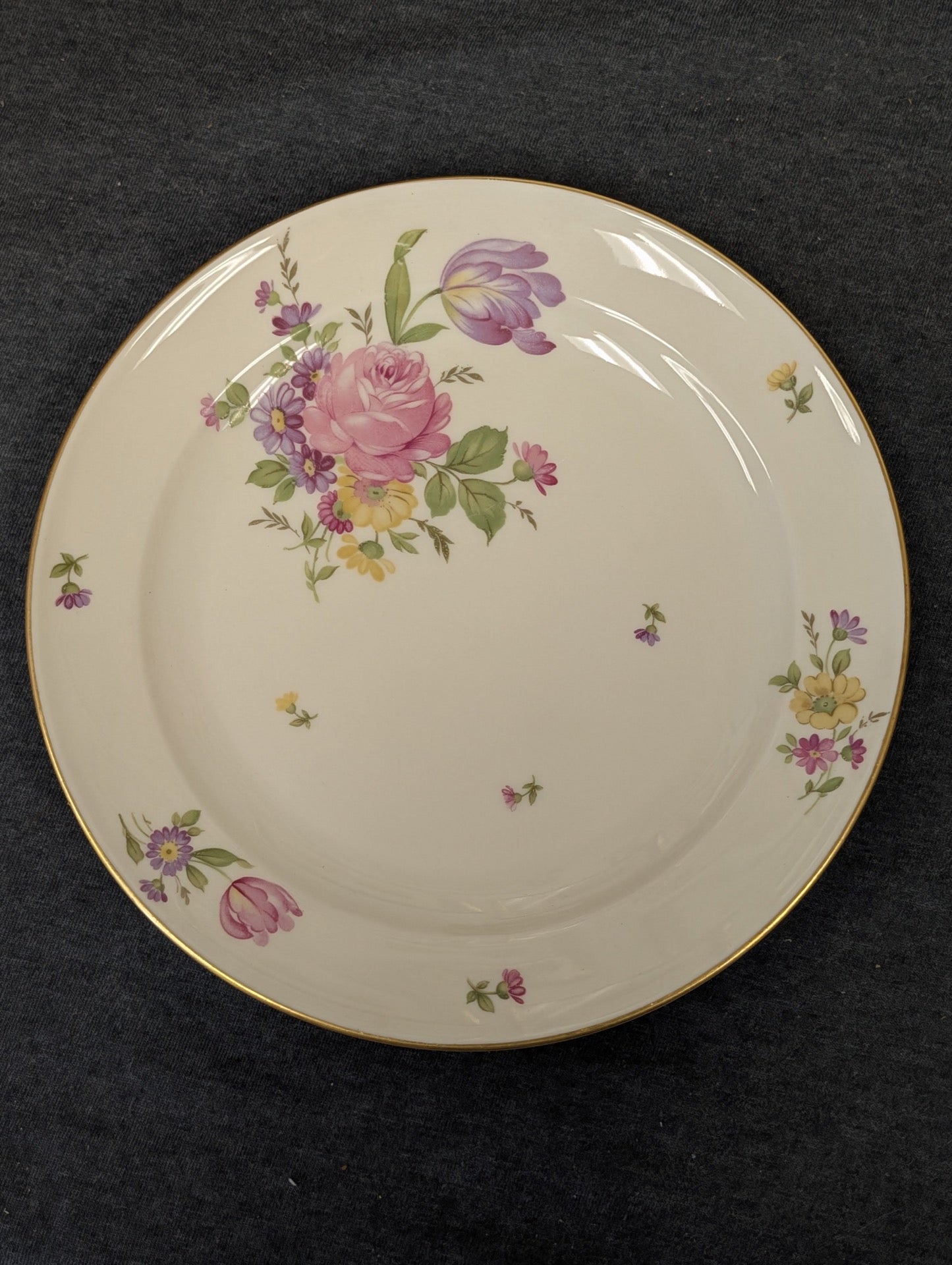 Vintage Rosenthal plate with tulips and roses on an ivory background