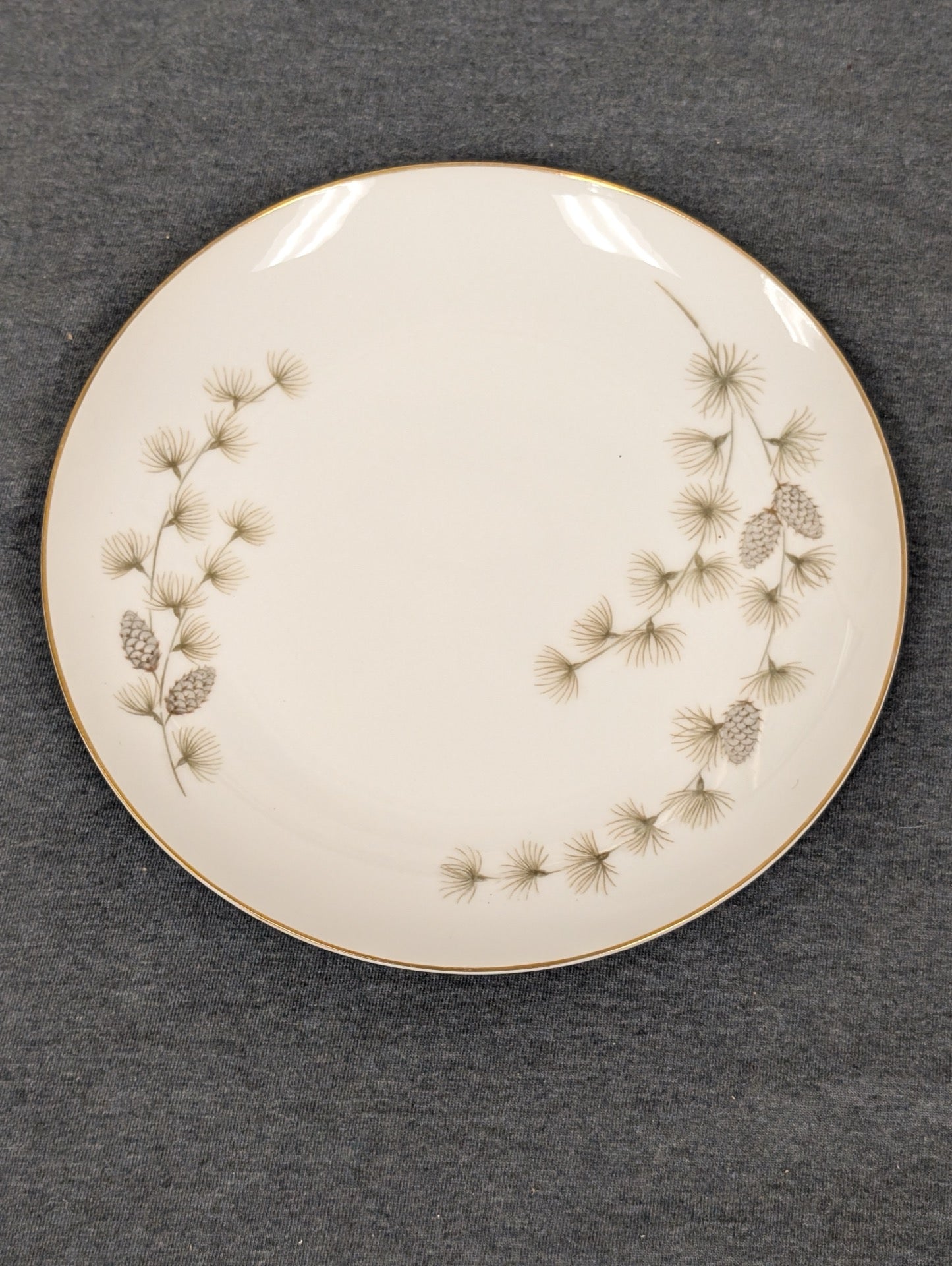 Front of Mikasa Sequoia 6141 plate with pinecone and needle motif