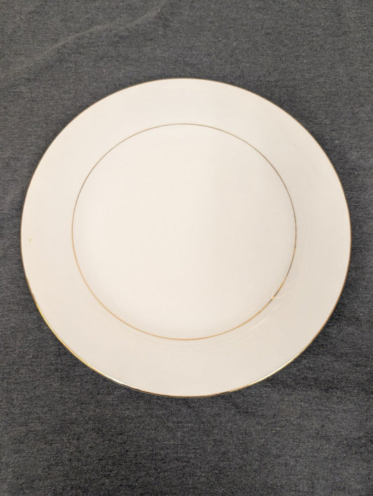 Crisp white Sakura dinner plate with a gold rim.