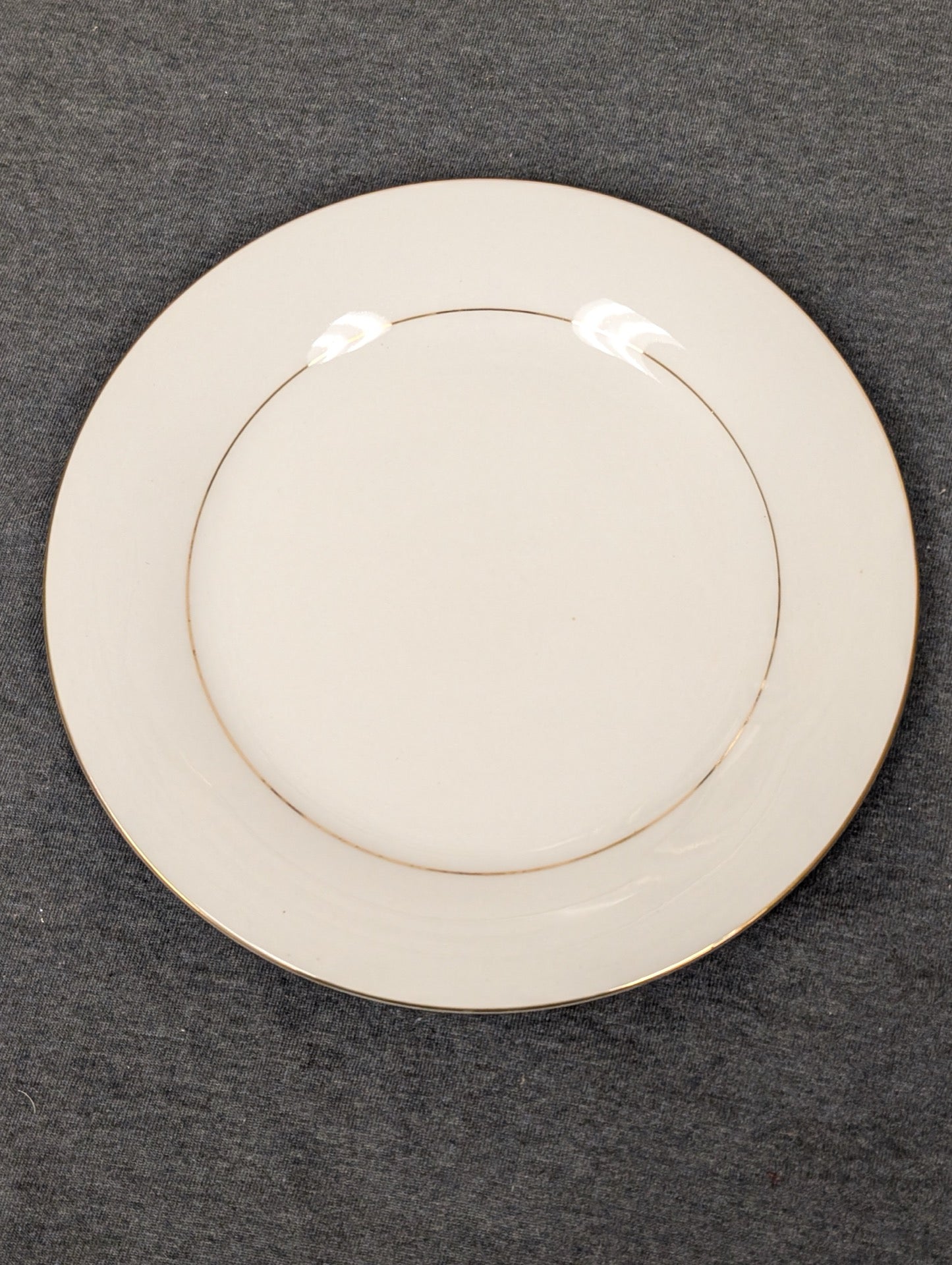 Top view of beautiful vintage Sakura Classic Gold fine china plate.
