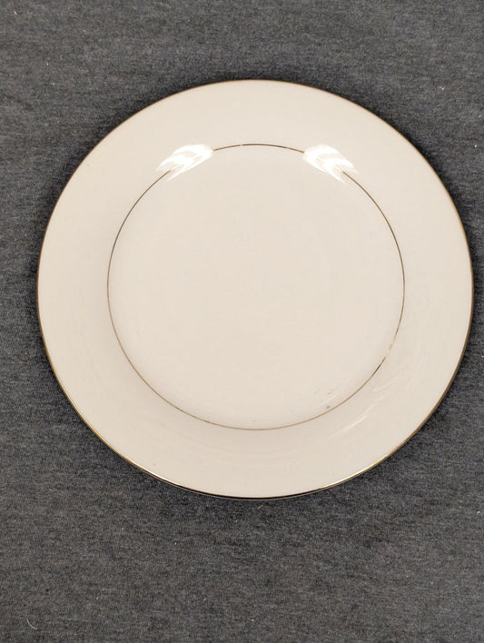 Front face of a pristine Sakura Classic Gold white dinner plate.