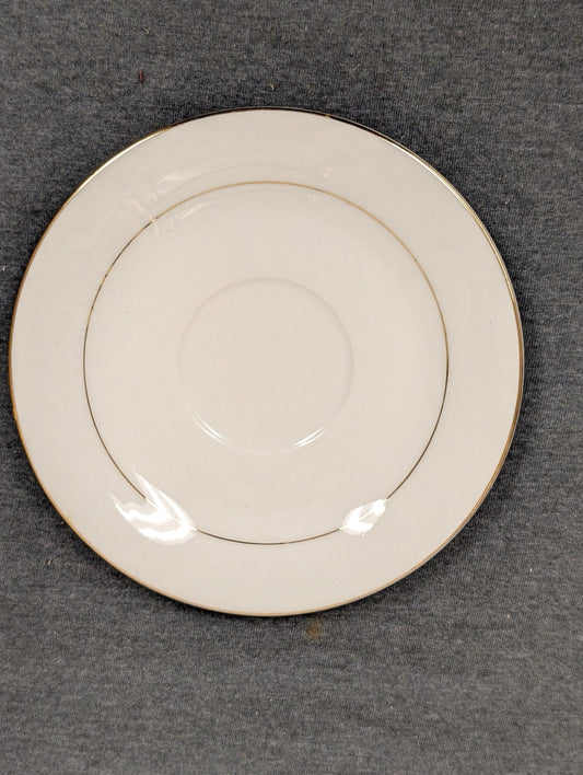 Angled top view of the Sakura Classic Gold saucer