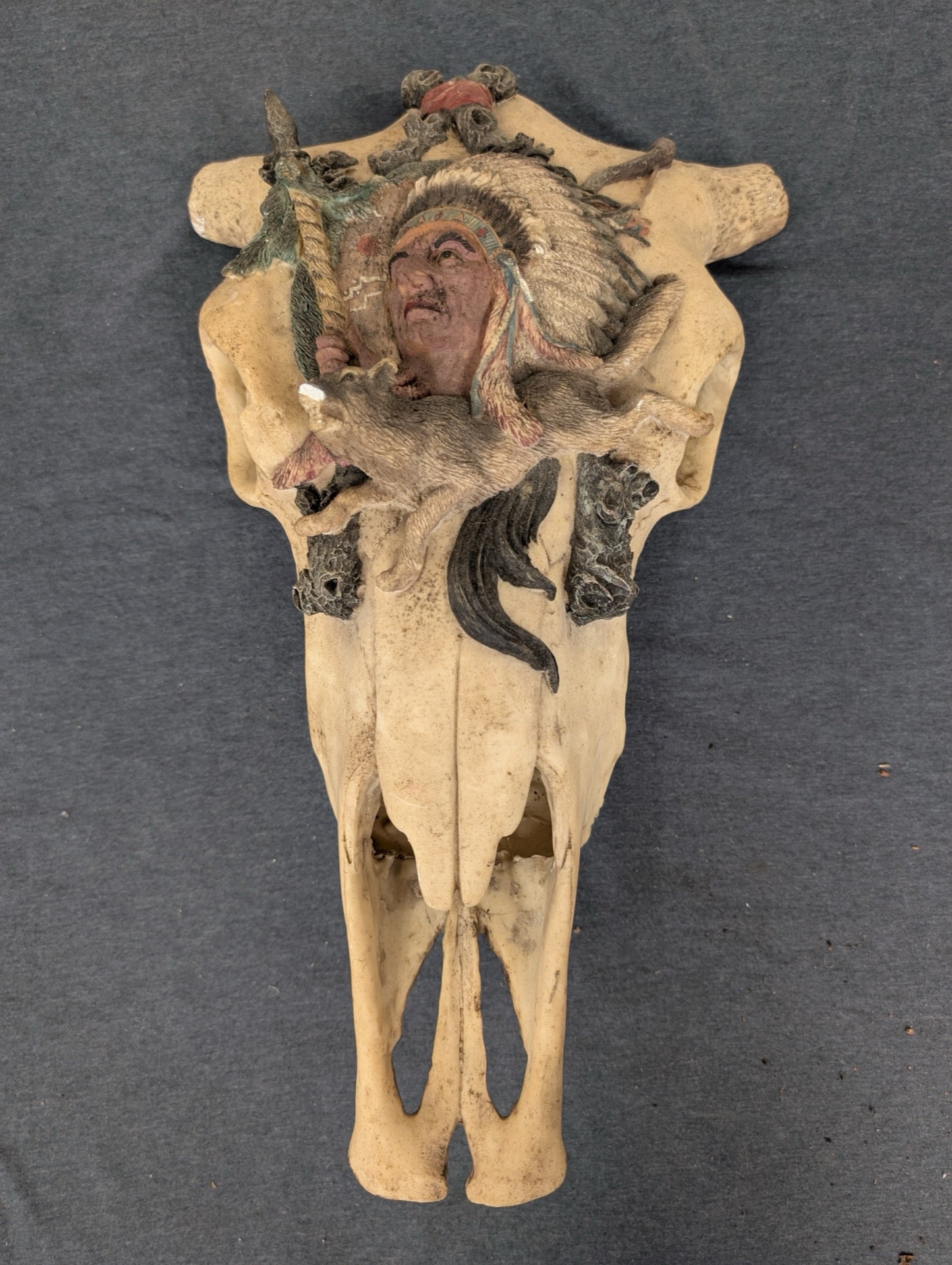 Faux cow skull wall hanging featuring a 3D Native American chief and wolf