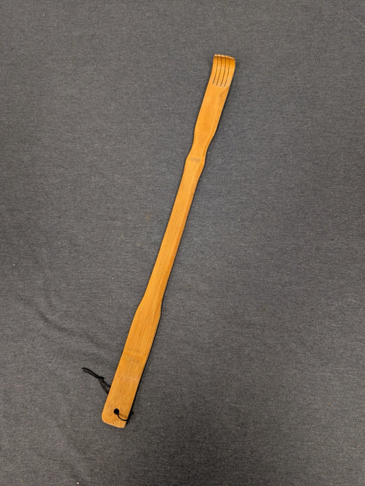 Long wooden bamboo backscratcher with curved fingers at the top