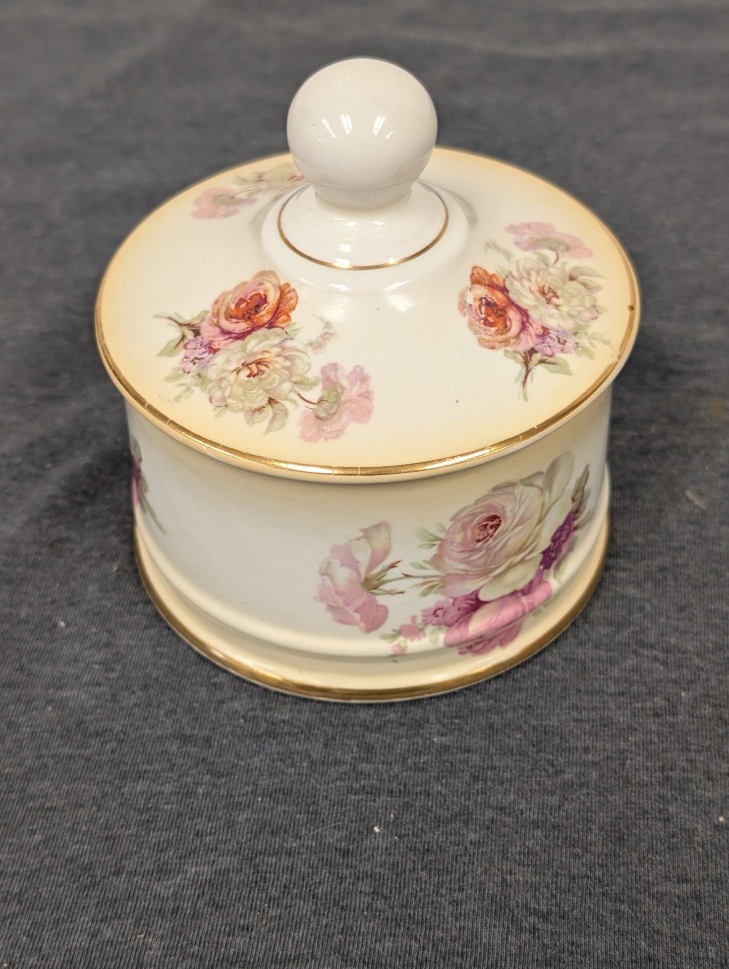 Closed vintage Old Foley porcelain trinket box with delicate floral pink rose motif.