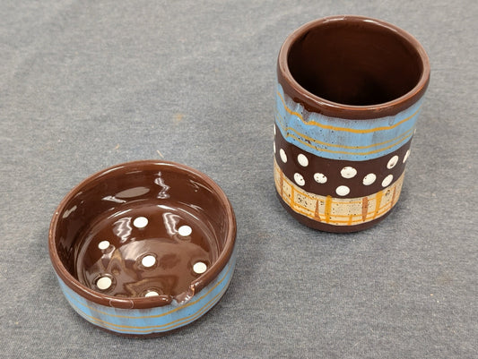 Vintage brown and blue glazed pottery set with an ashtray and small matching cup.