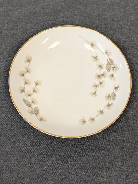 Front view of a vintage Mikasa Fine China Sequoia 6141 plate with pinecone motif.