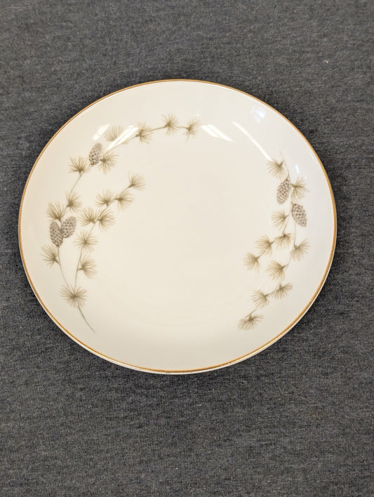 Angled front view of the Mikasa Sequoia plate showing the asymmetrical design.