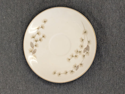 Top view of vintage Mikasa Sequoia saucer with pinecone detailing