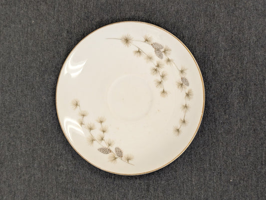 Top down view of Mikasa Sequoia saucer with pine cone graphics