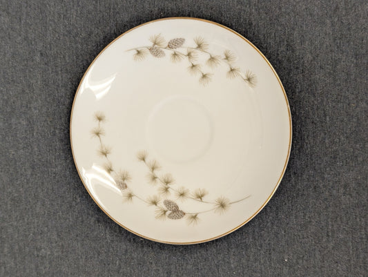 Rustic Mikasa fine china saucer featuring a delicate pinecone pattern.