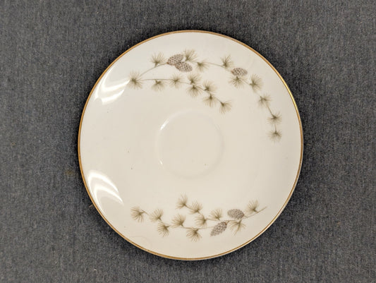 Pristine Mikasa fine china saucer showcasing elegant pinecones.