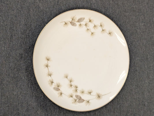 Vintage Mikasa plate with pinecone and pine needle design with gold rim.