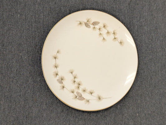 Round white dinner plate with vintage pinecone design by Mikasa.