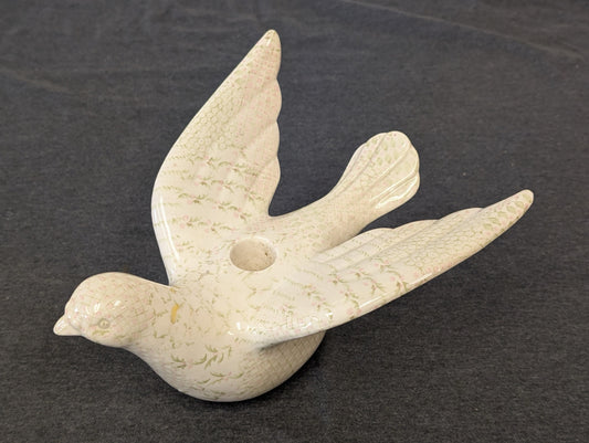 Ceramic dove figurine with pink and green floral pattern