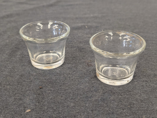 Two clear glass flared small cups suitable for votives or shots