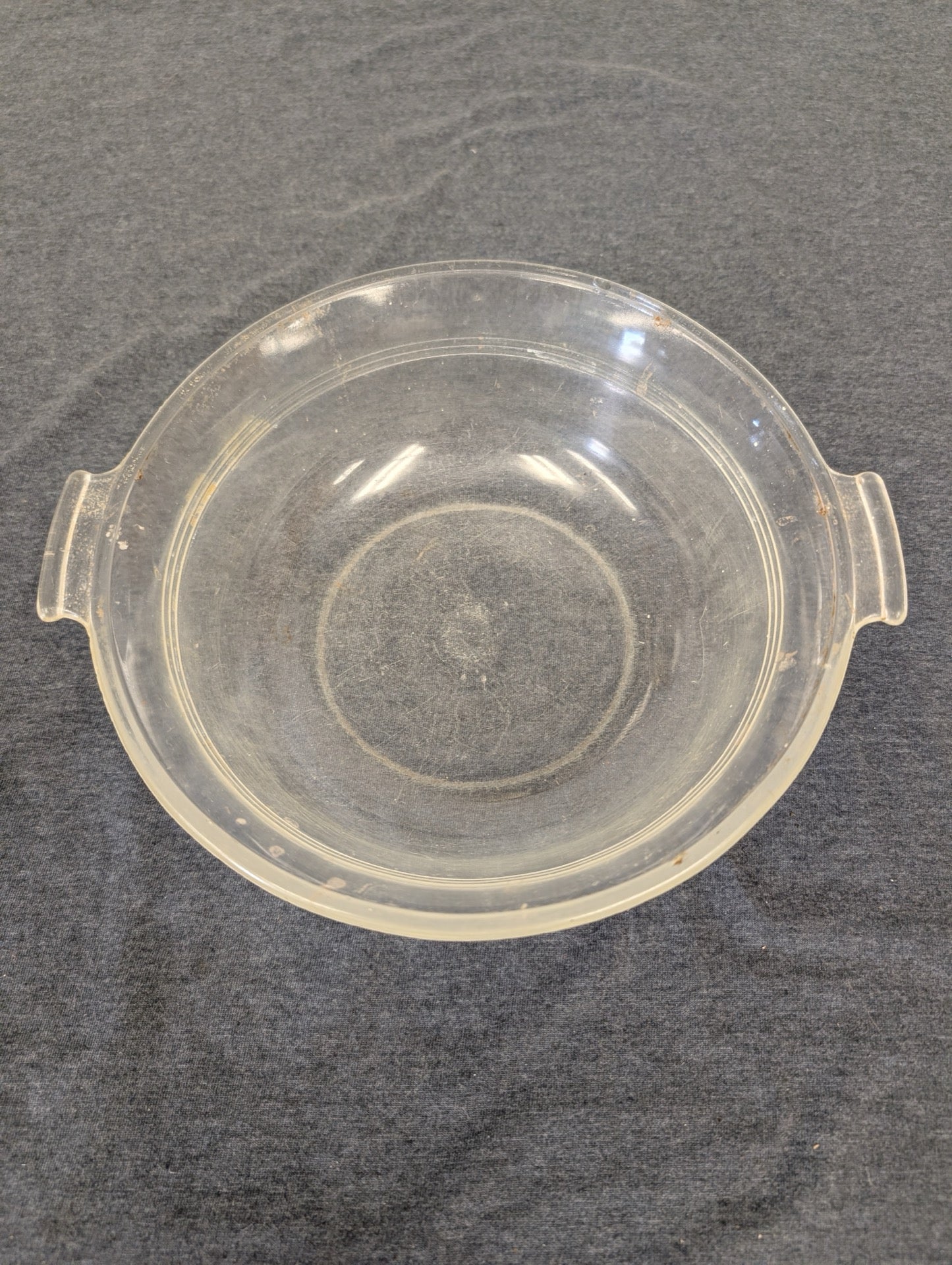 Clear glass deep round bowl or baking dish with side handles