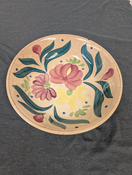 Ceramic bowl with hand painted pink and yellow flowers and green foliage