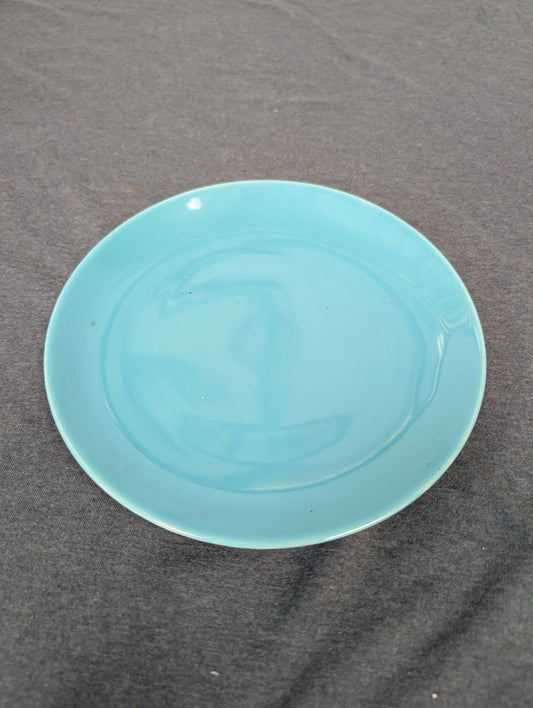 Solid teal blue ceramic shallow plate.