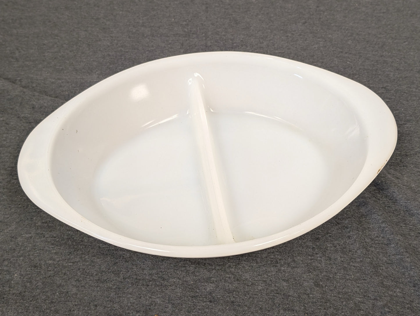 Top view of a white milk glass divided oval baking dish by Glasbake.
