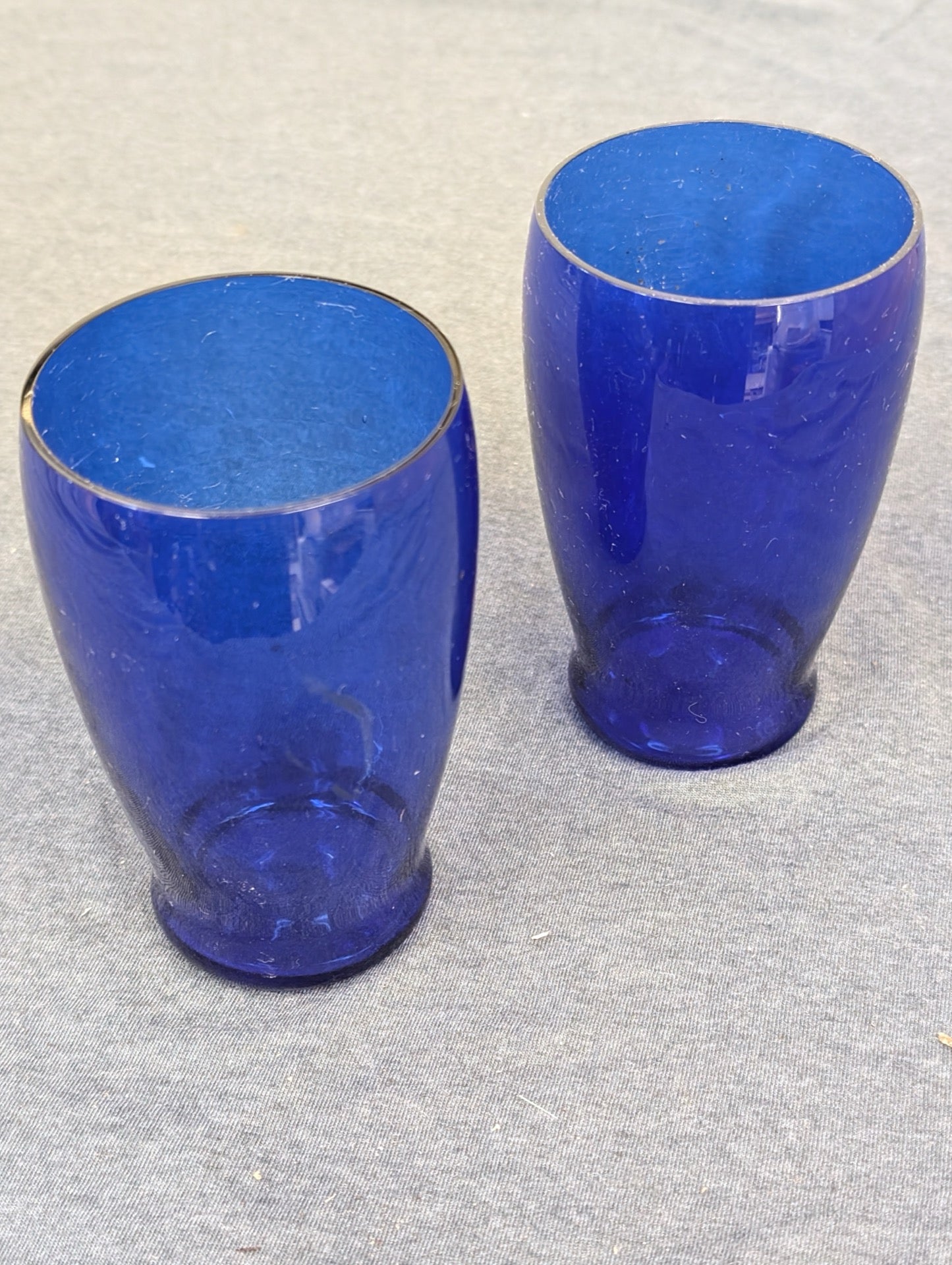 Two plain vintage cobalt blue glass drinking tumblers.