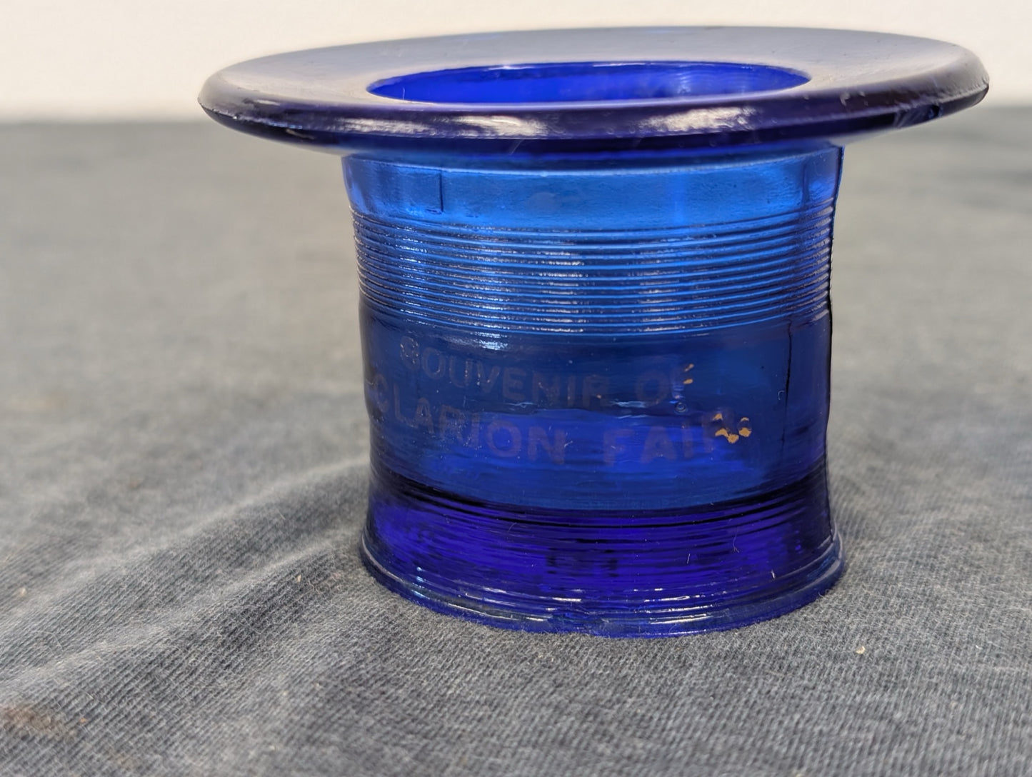 Cobalt blue glass top hat shape etched with Souvenir of Clarion Fair.