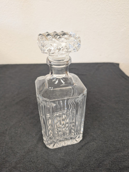 Vintage clear glass liquor decanter with diamond stopper.