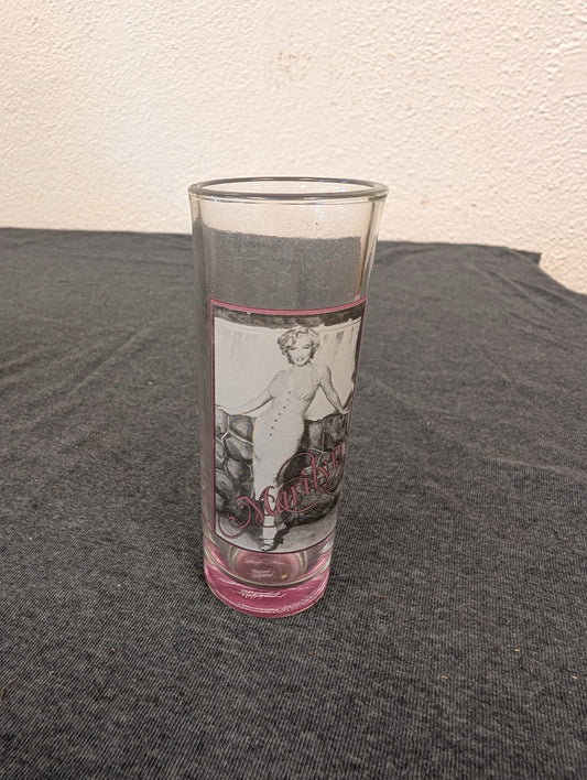 Clear tumbler featuring Marilyn Monroe in a white dress leaning against a wall