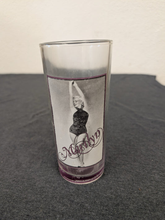 Clear tall drinking glass with a picture of Marilyn Monroe in a black outfit