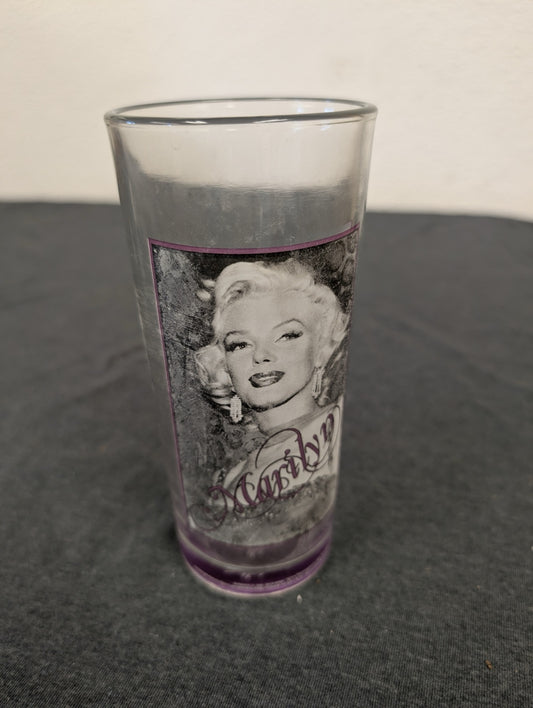 Clear tumbler with Marilyn Monroe face portrait and a purple border frame