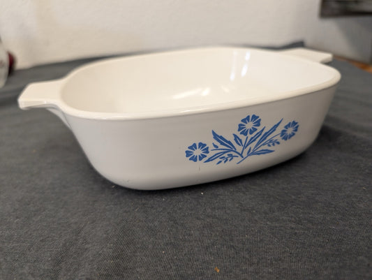 Vintage Corning Ware Cornflower Blue 1 Qt square baking dish on a gray surface
