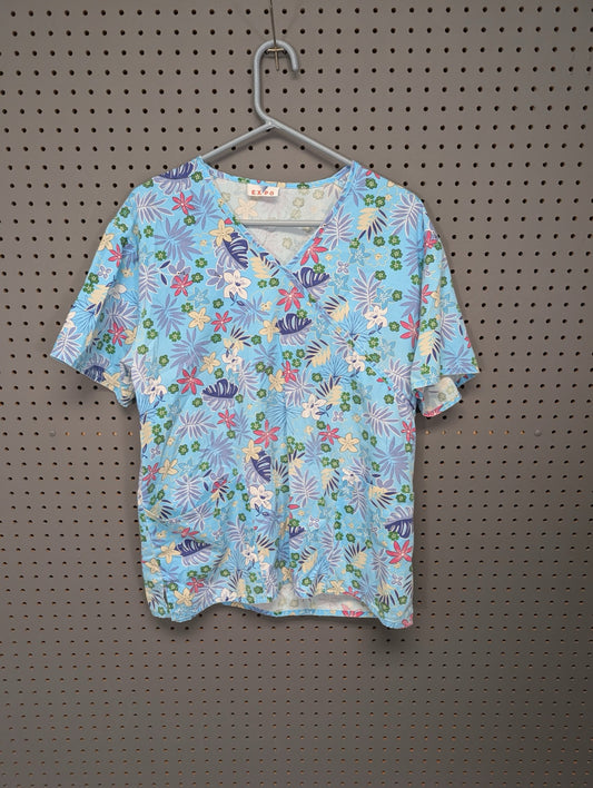 Front view of EXPO tropical floral scrub top