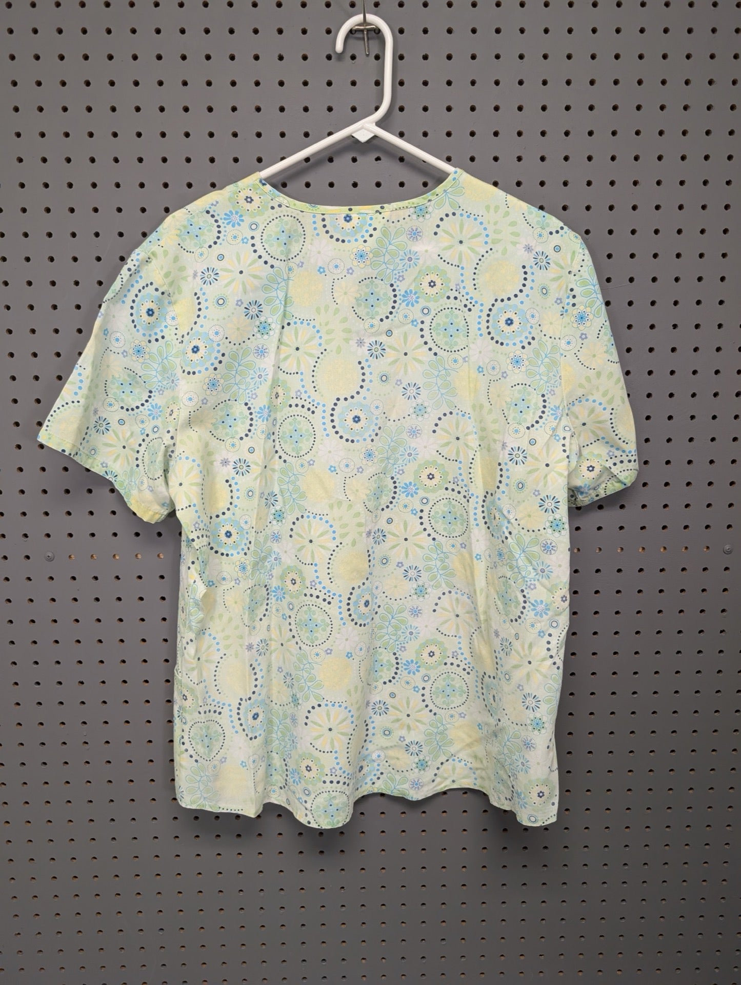 Back view of SB Scrubs geometric scrub top