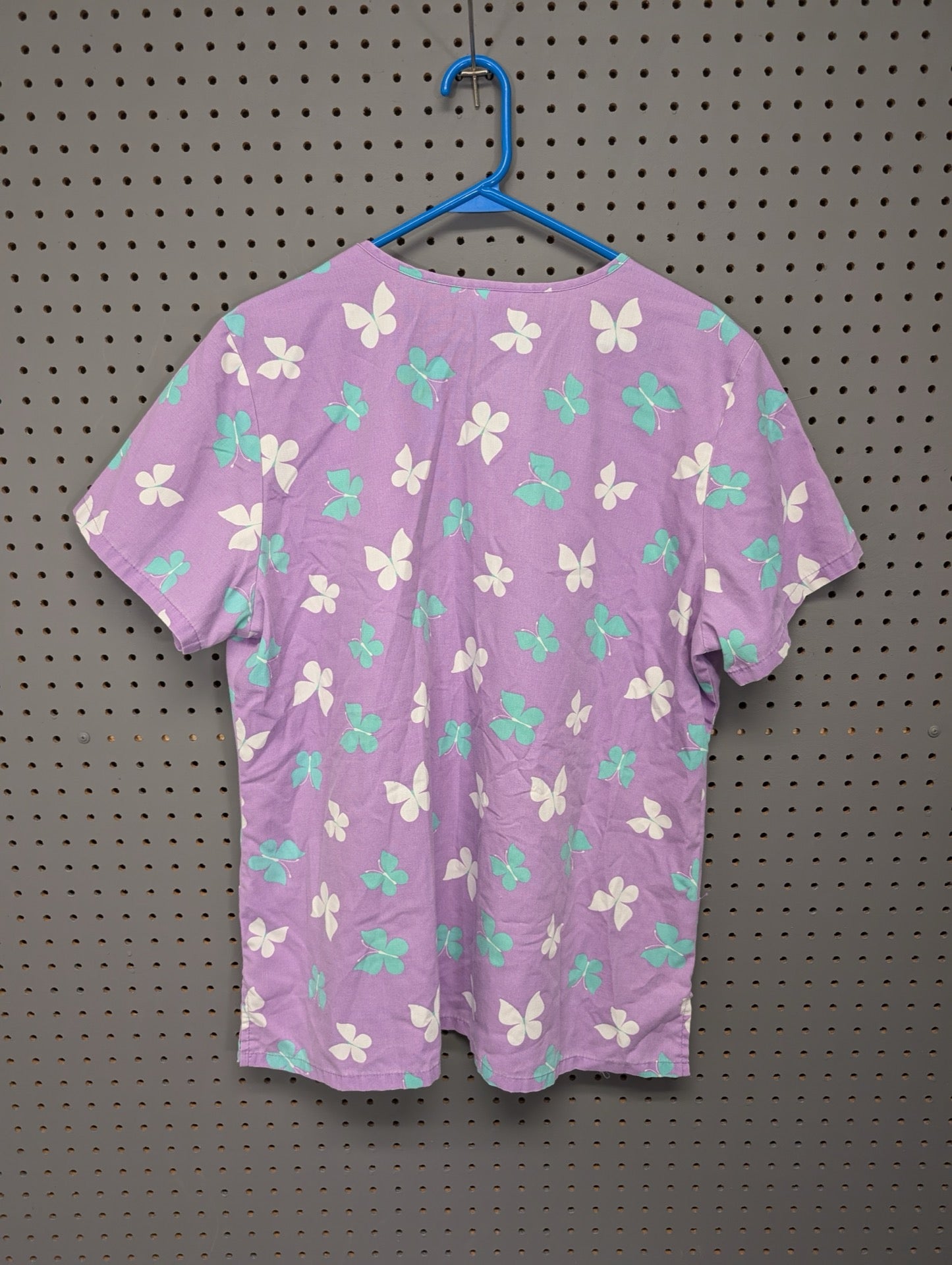 Back view of purple butterfly scrub top