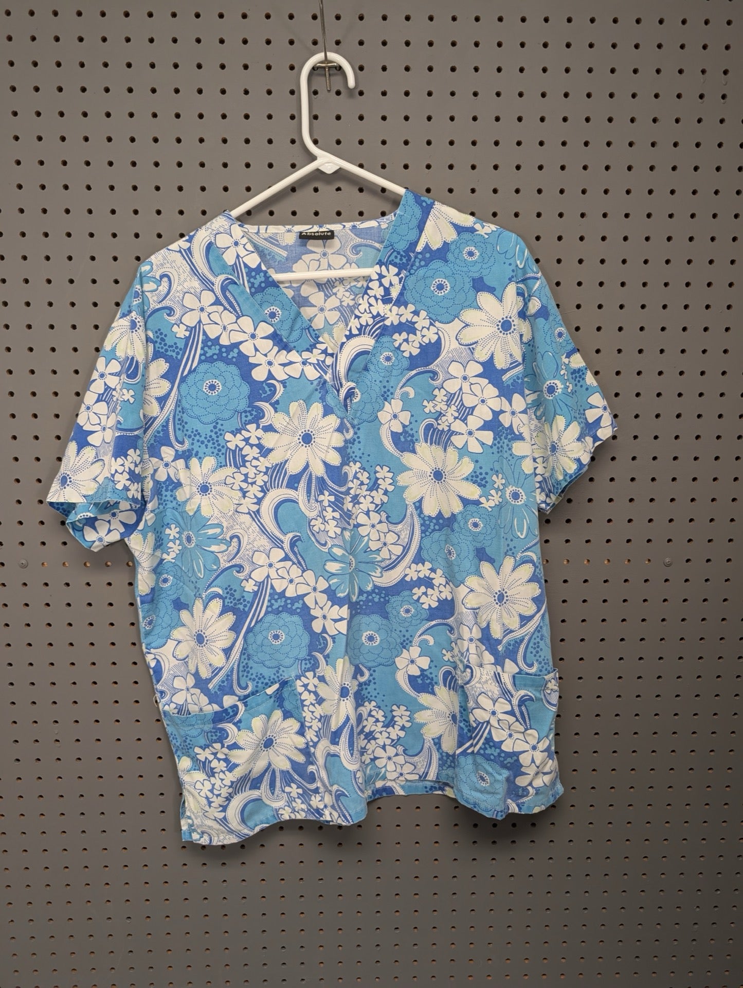Front view of Absolute blue floral scrub top