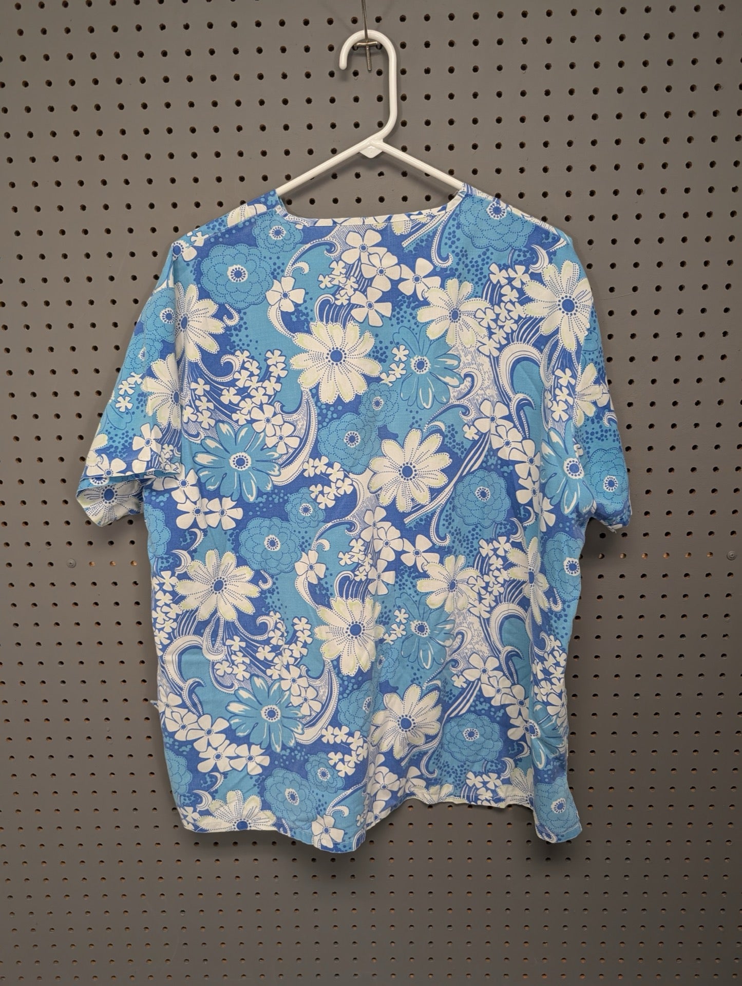 Back view of Absolute blue floral scrub top