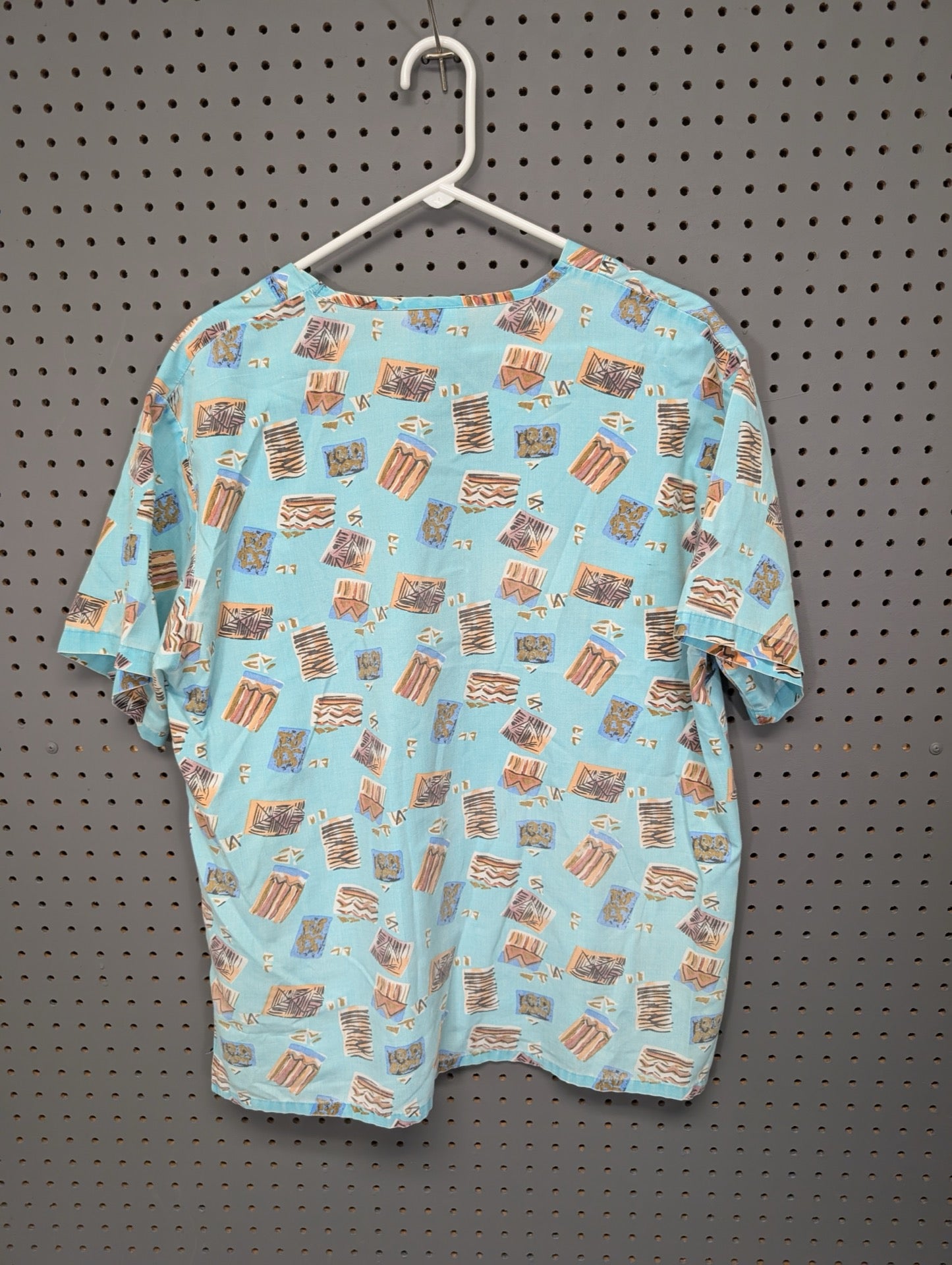 Back view of EXPO vintage geometric scrub top