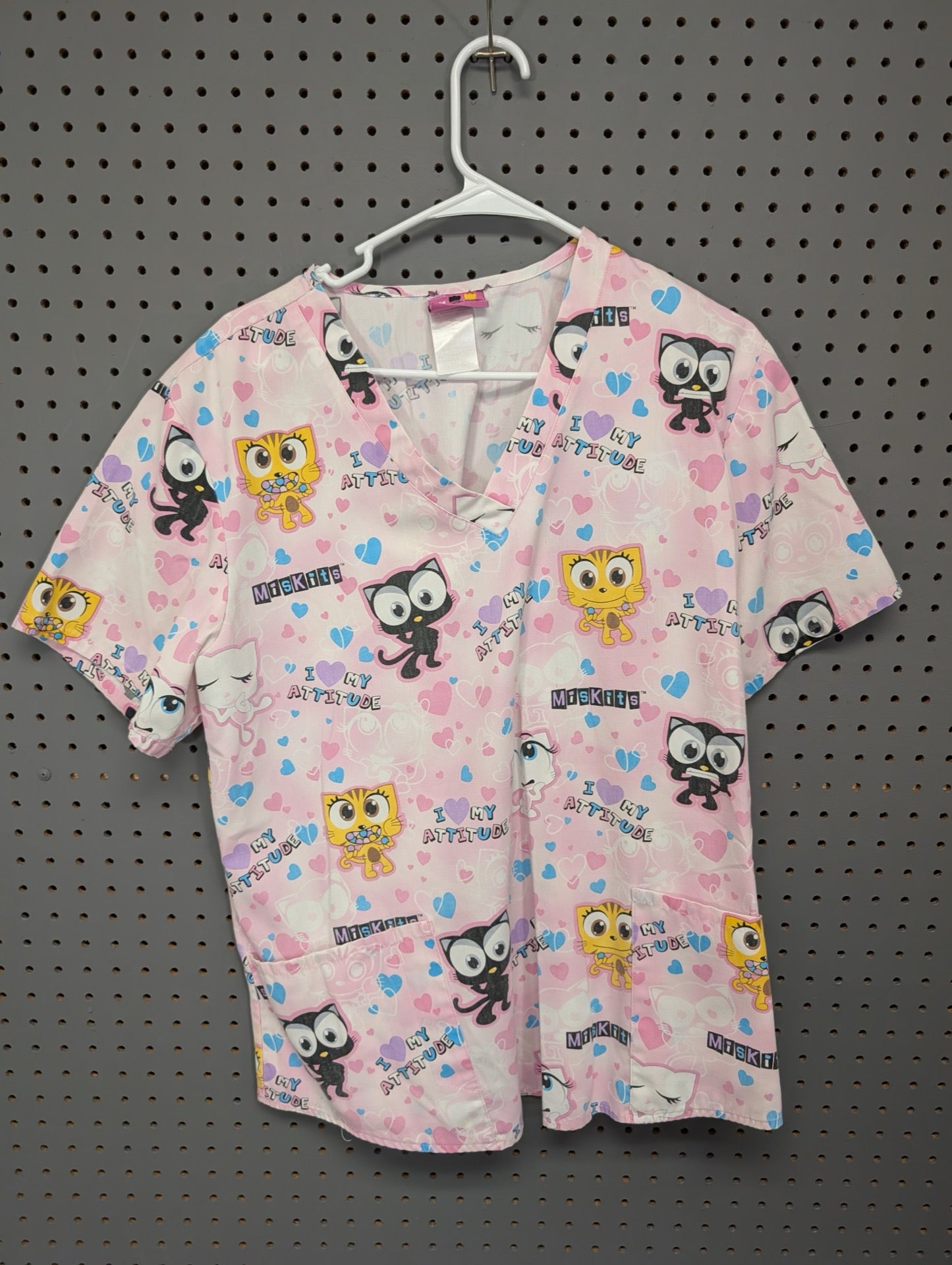 Front view of Miskits pink cat scrub top