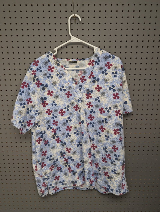 Front view of Absolute blue and red floral scrub top