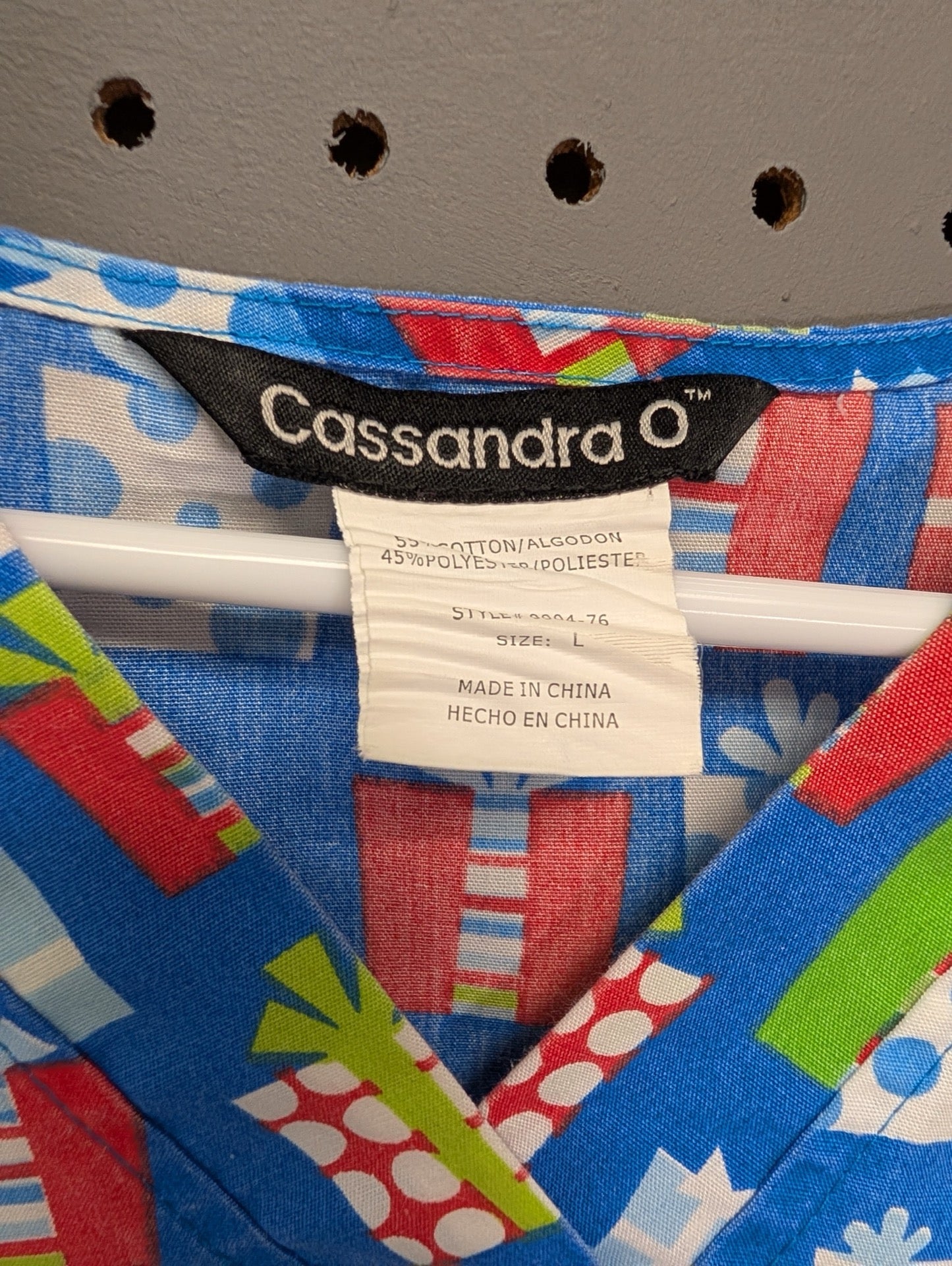 Tag showing Cassandra O brand and size Large