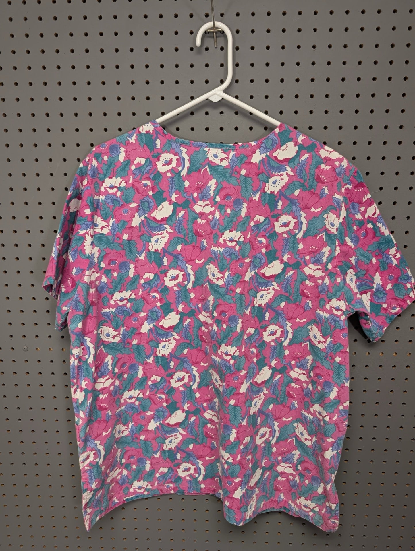 Back view of Brisco Apparel floral scrub top