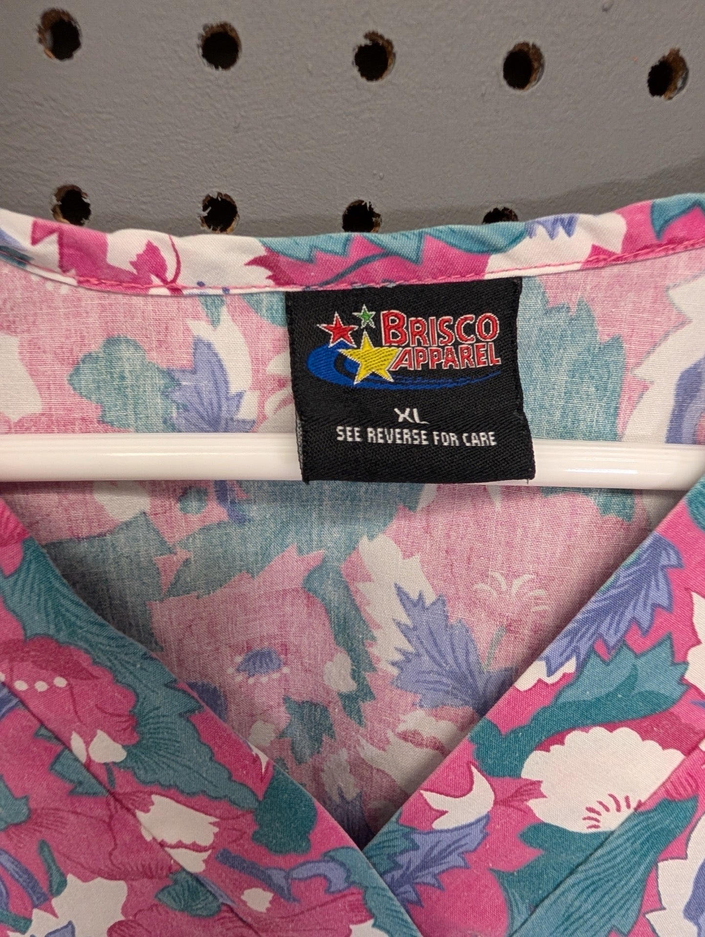 Tag showing Brisco Apparel and size XL