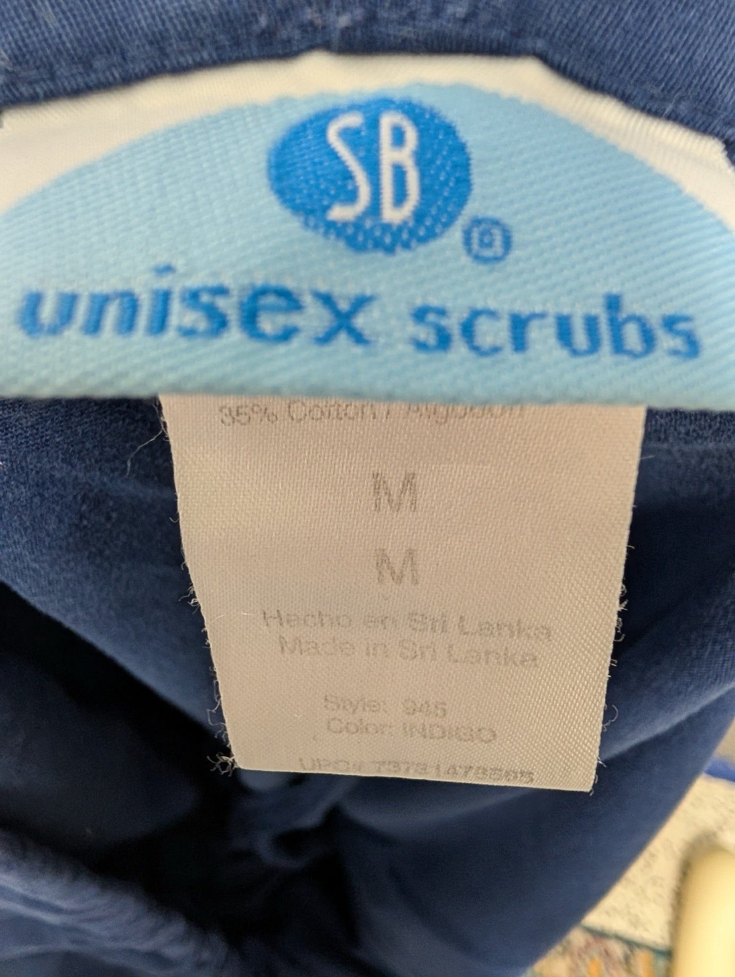 Tag showing SB Unisex Scrubs and size Medium