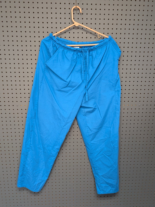 Front view of Cassandra O bright blue scrub pants