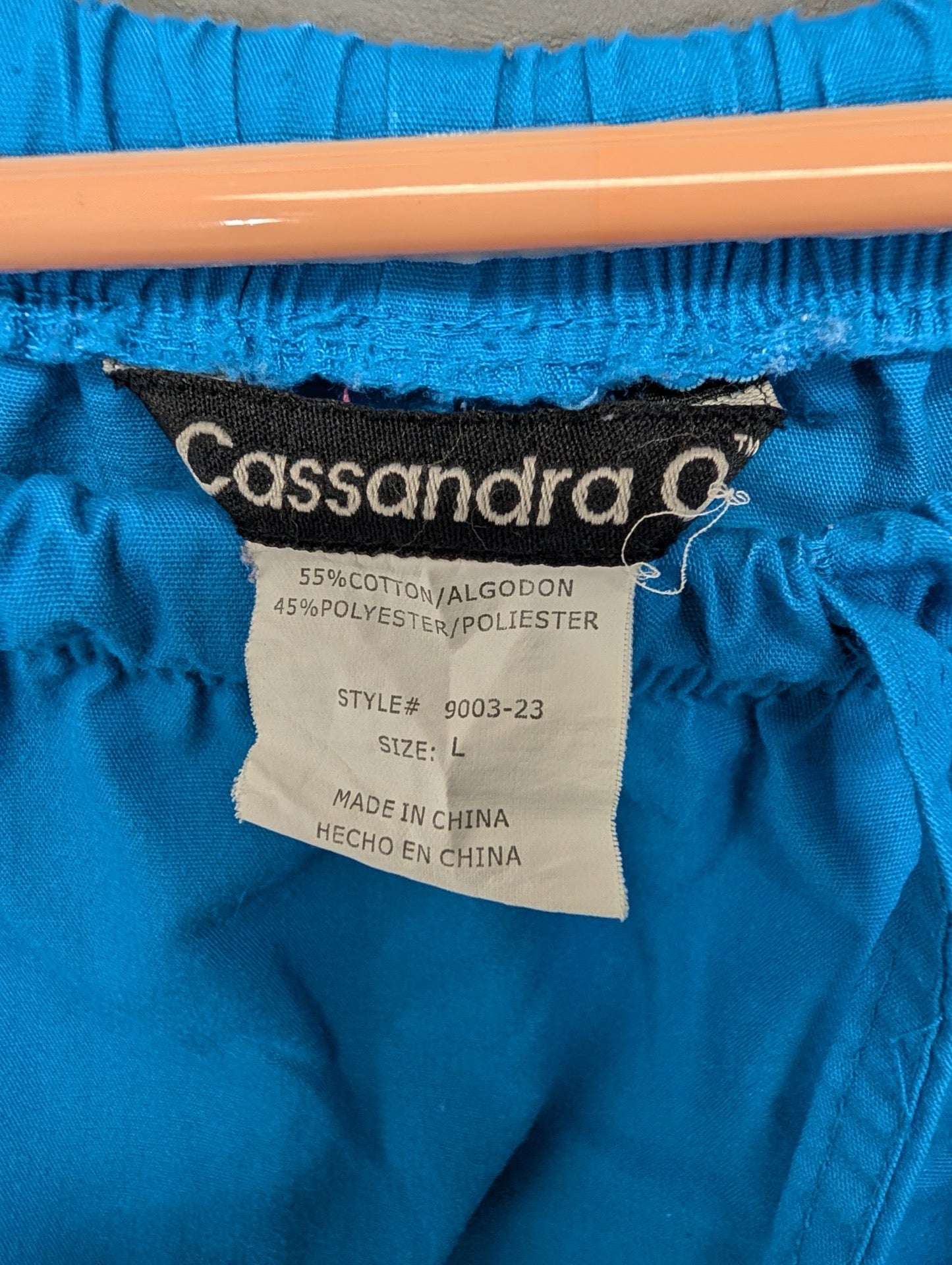 Tag showing Cassandra O brand and size Large